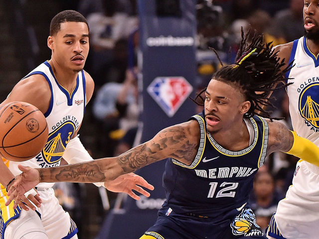 MEMPHIS, TENNESSEE - MAY 03: Ja Morant #12 of the Memphis Grizzlies handles the ball against Jordan Poole #3 of the Golden State Warriors during Game Two of the Western Conference Semifinals of the NBA Playoffs at FedExForum on May 03, 2022 in Memphis, Tennessee.