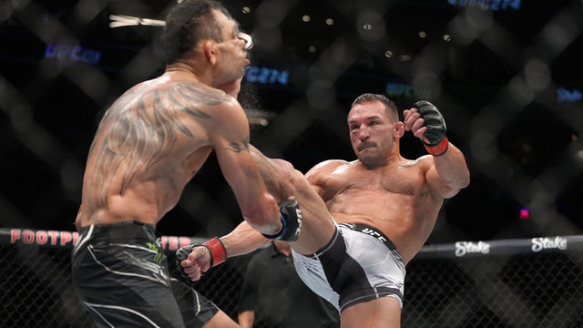 PHOENIX, ARIZONA - MAY 07: (R-L) Michael Chandler knocks out Tony Ferguson in a lightweight fight during the UFC 274 event at Footprint Center on May 07, 2022 in Phoenix, Arizona.