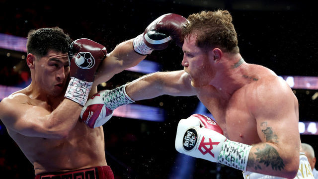 LAS VEGAS, NEVADA - MAY 07: Dmitry Bivol (L) exchanges punches with Canelo Alvarez during their WBA light heavyweight title fight at T-Mobile Arena on May 07, 2022 in Las Vegas, Nevada.