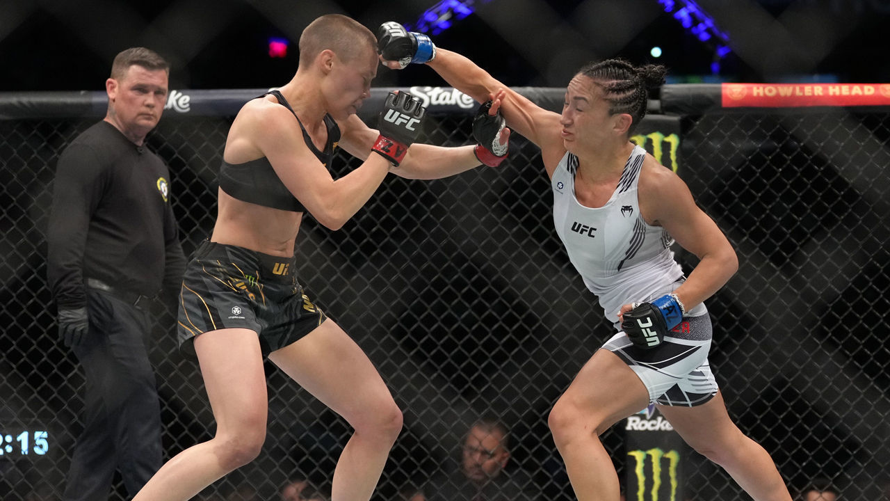 PHOENIX, ARIZONA - MAY 07: (R-L) Carla Esparza punches Rose Namajunas in the UFC strawweight championship fight during the UFC 274 event at Footprint Center on May 07, 2022 in Phoenix, Arizona.