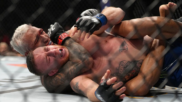 PHOENIX, ARIZONA - MAY 07: (L-R) Charles Oliveira of Brazil secures a rear choke submission against Justin Gaethje in the UFC lightweight championship fight during the UFC 274 event at Footprint Center on May 07, 2022 in Phoenix, Arizona.