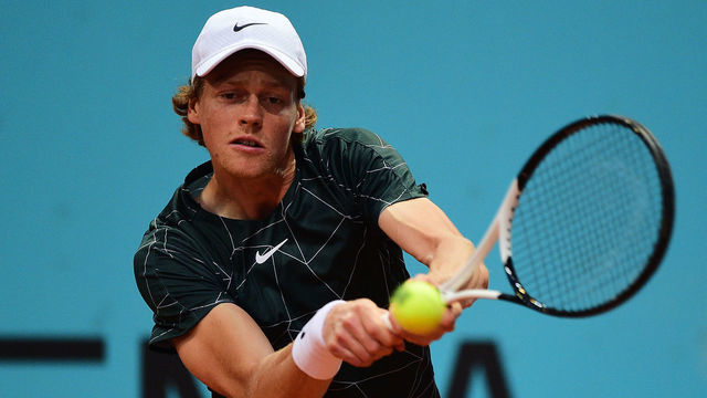 MADRID, SPAIN - MAY 04: Jannik Sinner of Italy plays a backhand in their third round match against Alex de Minaur of Australia on day seven of Mutua Madrid Open at La Caja Magica on May 04, 2022 in Madrid, Spain.
