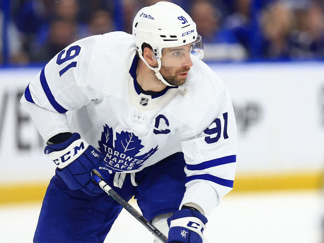 TAMPA, FLORIDA - MAY 08: John Tavares #91 of the Toronto Maple Leafs looks to pass in the third period during Game Four of the First Round of the 2022 Stanley Cup Playoffs against the Tampa Bay Lightning at Amalie Arena on May 08, 2022 in Tampa, Florida.