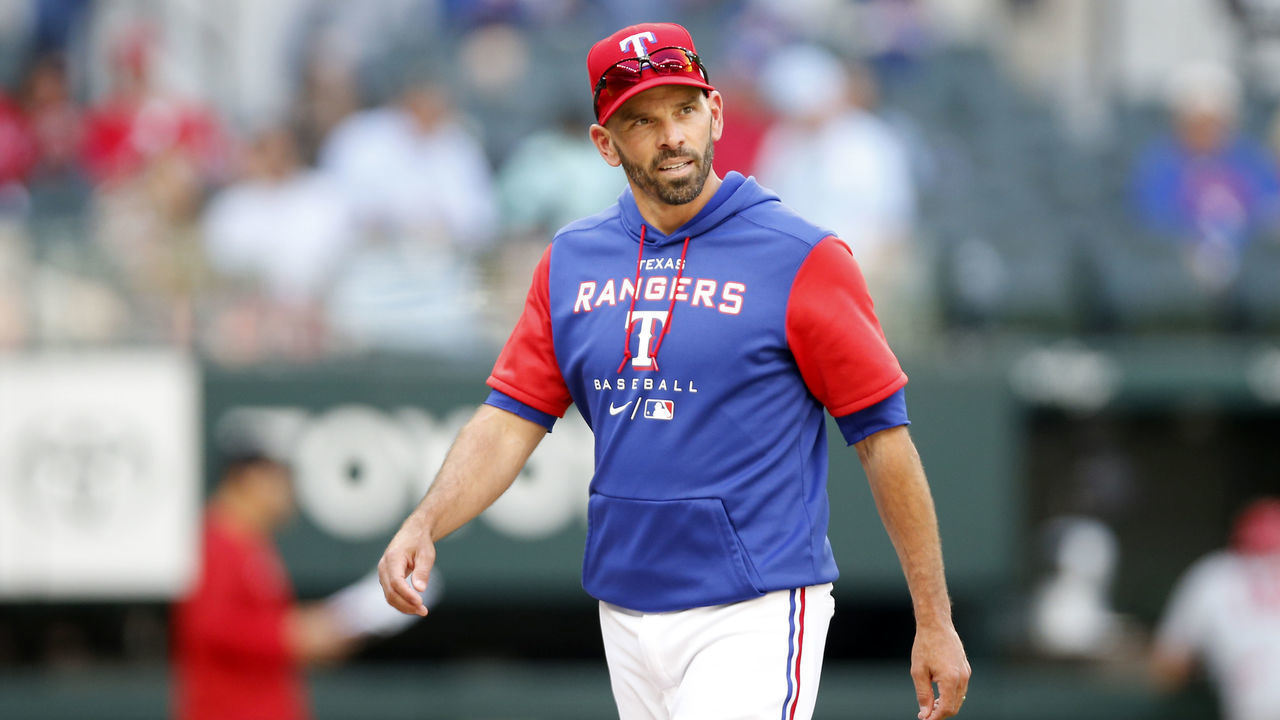 ARLINGTON, TEXAS - APRIL 17: Chris Woodward #8 of the Texas Rangers walks off the field in the game against the Los Angeles Angels at Globe Life Field on April 17, 2022 in Arlington, Texas.