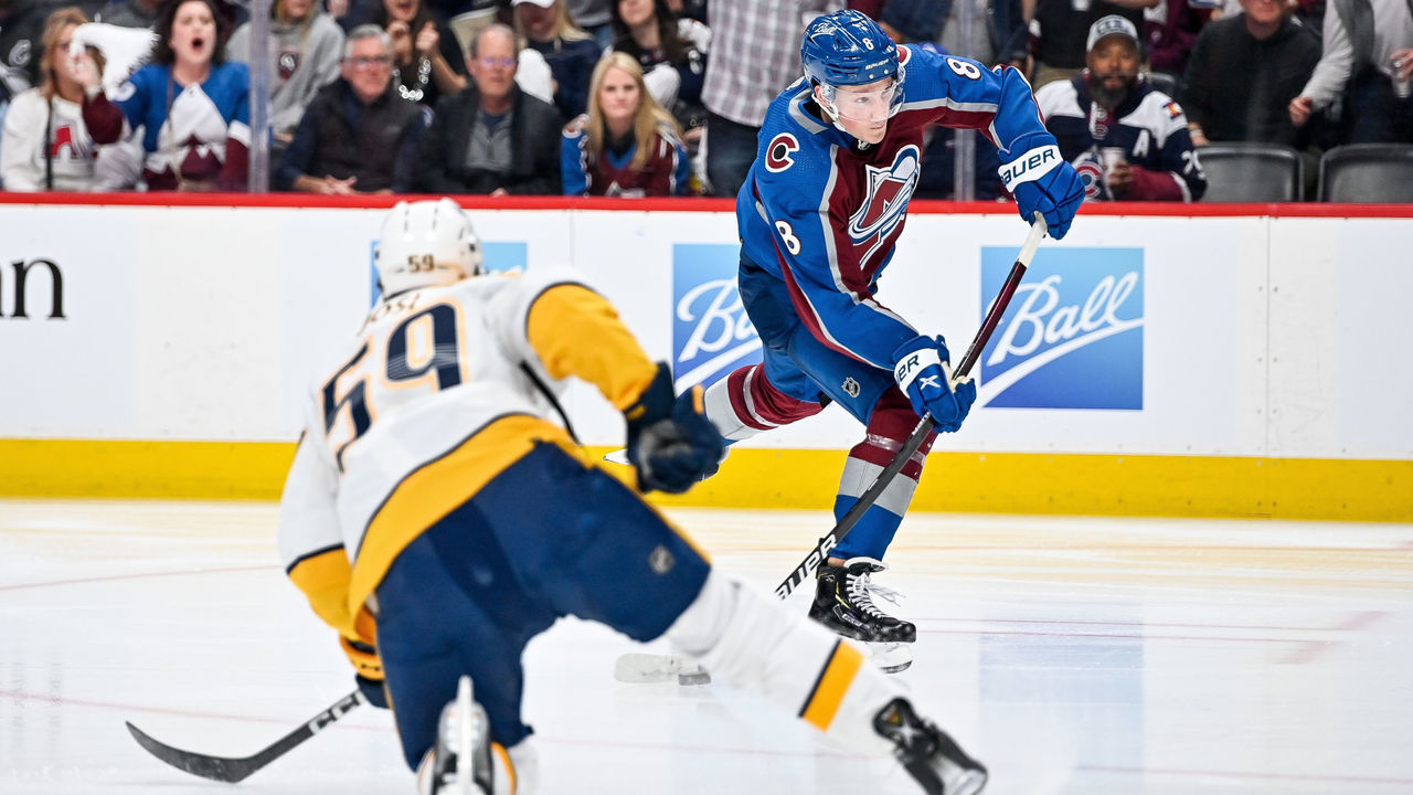 DENVER, CO - MAY 05: Colorado Avalanche defenseman Cale Makar (8) shoots past Nashville Predators defenseman Roman Josi (59) during a Stanley Cup Playoffs round 1 game between the Nashville Predators and the Colorado Avalanche at Ball Arena in Denver, Colorado on May 5, 2022.