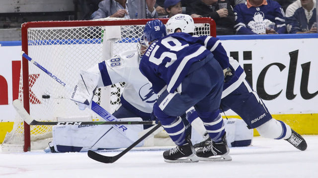 TORONTO, ON - May 4 In second period action, Michael Bunting (58) of the Toronto Maple Leafs drops in a goal past Andrei Vasilevskiy (88) of the Tampa Bay Lightning The Toronto Maple Leafs took on the Tampa Bay Lightning in NHL hockey action at the Scotiabank Arena in Toronto. This is the second game of the first round of playoffs May 4 2022 (Richard Lautens/Toronto Star via Getty Images)