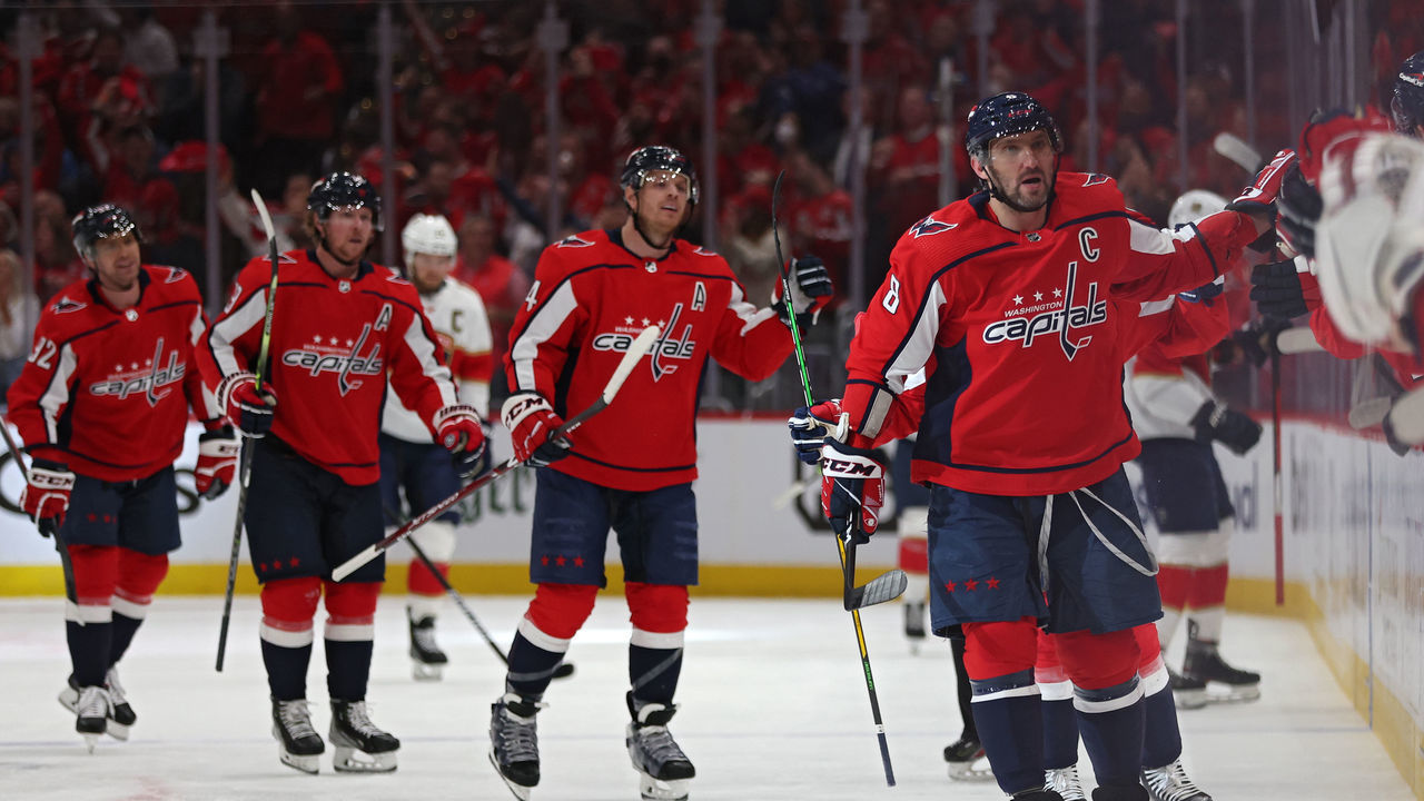WASHINGTON, DC - MAY 09: Alex Ovechkin #8 of the Washington Capitals celebrates a goal by teammate T.J. Oshie #77 against the Florida Panthers during the first period in Game Four of the First Round of the 2022 Stanley Cup Playoffs at Capital One Arena on May 09, 2022 in Washington, DC.