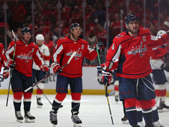 WASHINGTON, DC - MAY 09: Alex Ovechkin #8 of the Washington Capitals celebrates a goal by teammate T.J. Oshie #77 against the Florida Panthers during the first period in Game Four of the First Round of the 2022 Stanley Cup Playoffs at Capital One Arena on May 09, 2022 in Washington, DC.