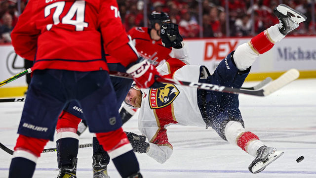 WASHINGTON, DC - MAY 09: Sam Bennett #9 of the Florida Panthers is checked by T.J. Oshie #77 of the Washington Capitals during the third period in Game Four of the First Round of the 2022 Stanley Cup Playoffs at Capital One Arena on May 09, 2022 in Washington, DC.