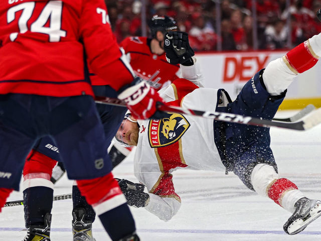 WASHINGTON, DC - MAY 09: Sam Bennett #9 of the Florida Panthers is checked by T.J. Oshie #77 of the Washington Capitals during the third period in Game Four of the First Round of the 2022 Stanley Cup Playoffs at Capital One Arena on May 09, 2022 in Washington, DC.