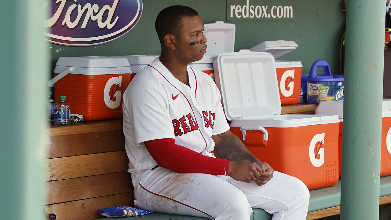 BOSTON, MA - MAY 5: Rafael Devers #11 of the Boston Red Sox sits alone in the dugout during the ninth inning of their 8-0 loss to the Los Angeles Angels at Fenway Park on May 5, 2022 in Boston, Massachusetts.