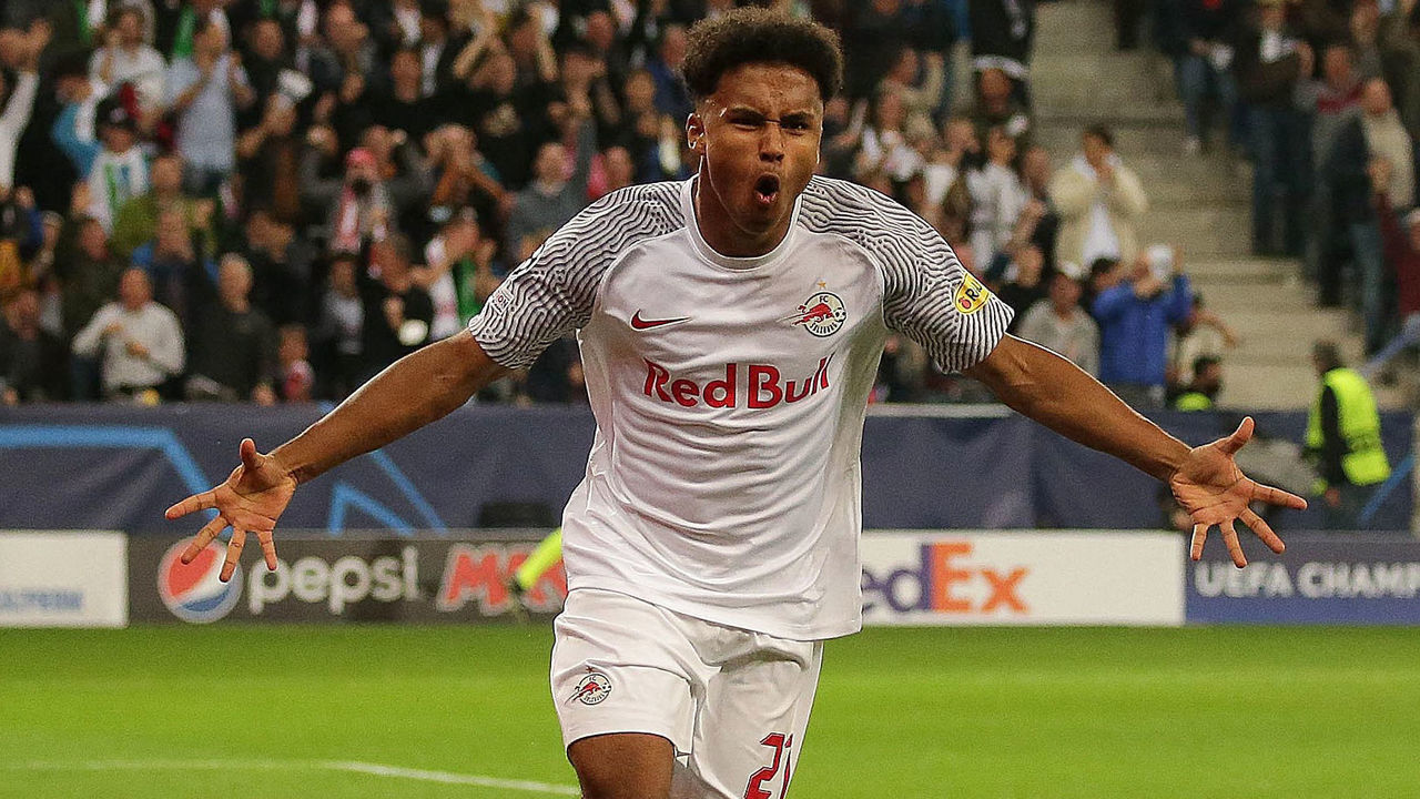 Salzburg's German forward Karim Adeyemi celebrates scoring the opening goal during the UEFA Champions League Group G football match between RB Salzburg and VfL Wolfsburg in Salzburg, Austria on October 20, 2021. - Austria OUT