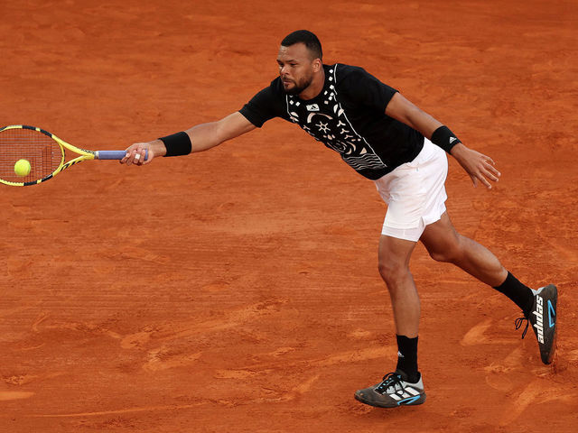 MONTE-CARLO, MONACO - APRIL 11: Jo-Wilfried Tsonga of France in action against Marin Cilic of Croatia during day two of the Rolex Monte-Carlo Masters at Monte-Carlo Country Club on April 11, 2022 in Monte-Carlo, Monaco.