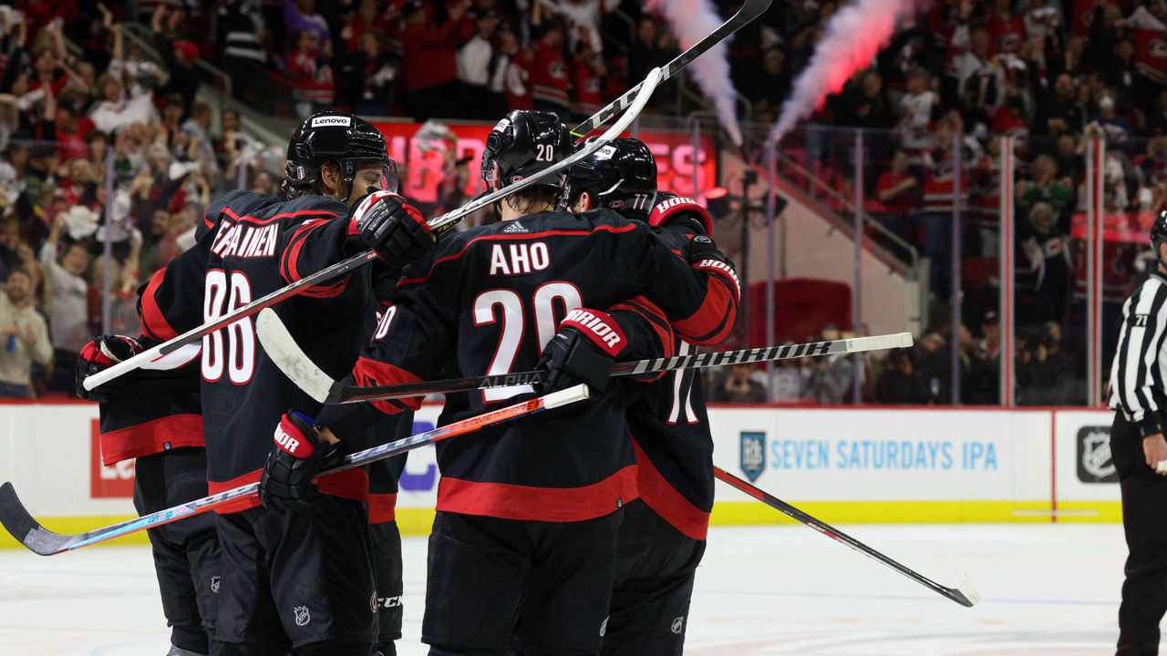 RALEIGH, NC - MAY 10: Seth Jarvis #24 of the Carolina Hurricanes scores a power play goal and celebrates with teammates during the second period in Game Five of the First Round of the 2022 Stanley Cup Playoffs against the Boston Bruins on May 10, 2022 at PNC Arena in Raleigh, North Carolina.