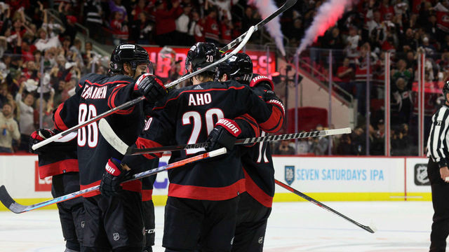 RALEIGH, NC - MAY 10: Seth Jarvis #24 of the Carolina Hurricanes scores a power play goal and celebrates with teammates during the second period in Game Five of the First Round of the 2022 Stanley Cup Playoffs against the Boston Bruins on May 10, 2022 at PNC Arena in Raleigh, North Carolina.