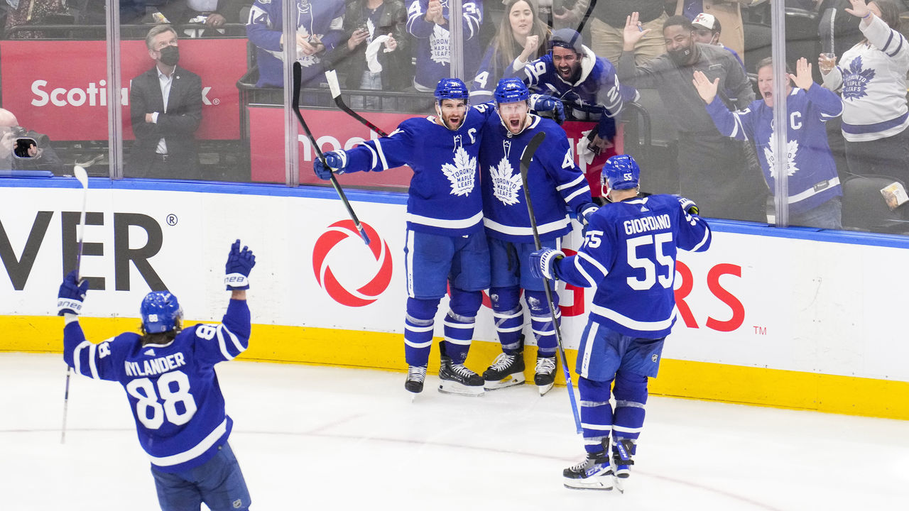 TORONTO, ON - MAY 10: Morgan Rielly #44 of the Toronto Maple Leafs celebrates his goal against the Tampa Bay Lightning with teammates John Tavares #91, Mark Giordano #55 and William Nylander #88 during the third period in Game Five of the First Round of the 2022 Stanley Cup Playoffs at the Scotiabank Arena on May 10, 2022 in Toronto, Ontario, Canada.