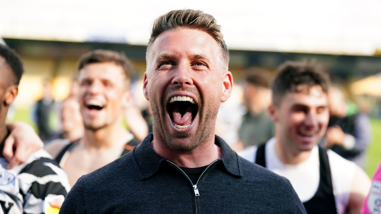 Forest Green Rovers manager Rob Edwards celebrating after his side won the league after the final whistle of the Sky Bet League Two match at the One Call Stadium, Mansfield. Picture date: Saturday May 7, 2022.