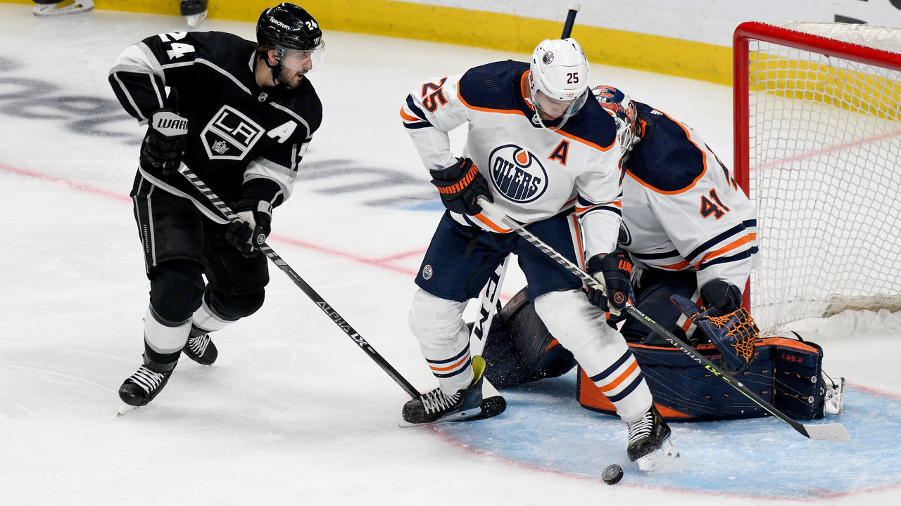 LOS ANGELES, CA - APRIL 07: Edmonton Oilers Goalie Mike Smith (41) makes a save as Edmonton Oilers Defenceman Darnell Nurse (25) and Los Angeles Kings Center Phillip Danault (24) look on during a Los Angeles Kings game versus the Edmonton Oilers on April 7, 2022, at the Crypto.com Arena in Los Angeles, CA.