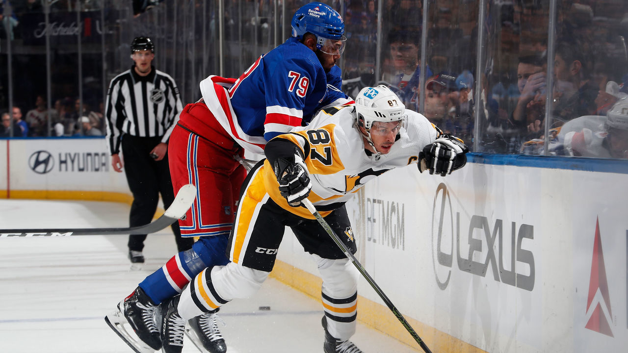 NEW YORK, NEW YORK - MAY 11: K'Andre Miller #79 of the New York Rangers checks Sidney Crosby #87 of the Pittsburgh Penguins in Game Five of the First Round of the 2022 Stanley Cup Playoffs at Madison Square Garden on May 11, 2022 in New York City.
