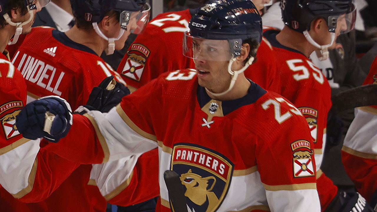 SUNRISE, FL - MAY 5: Teammates congratulate Carter Verhaeghe #23 of the Florida Panthers after he scored a second period goal against the Washington Capitals in Game Two of the First Round of the 2022 NHL Stanley Cup Playoffs at the FLA Live Arena on May 5, 2022 in Sunrise, Florida.