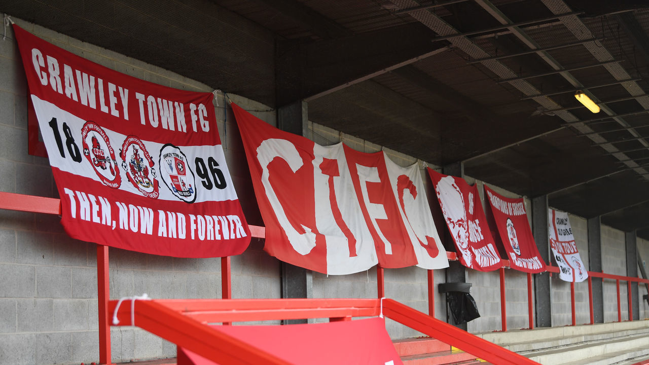 CRAWLEY, ENGLAND - JANUARY 10: Crawley Town supporters flags are seen inside the stadium prior to the FA Cup Third Round match between Crawley Town and Leeds United at The Peoples Pension Stadium on January 10, 2021 in Crawley, England. Sporting stadiums around England remain under strict restrictions due to the Coronavirus Pandemic as Government social distancing laws prohibit fans inside venues resulting in games being played behind closed doors.
