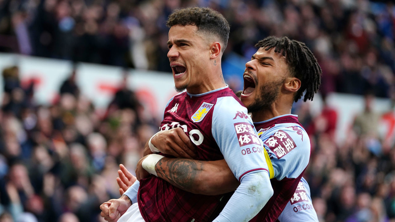 Aston Villa's Philippe Coutinho (left) celebrates scoring their side's third goal of the game with team-mate Tyrone Mings during the Premier League match at Villa Park, Birmingham. Picture date: Saturday March 5, 2022.