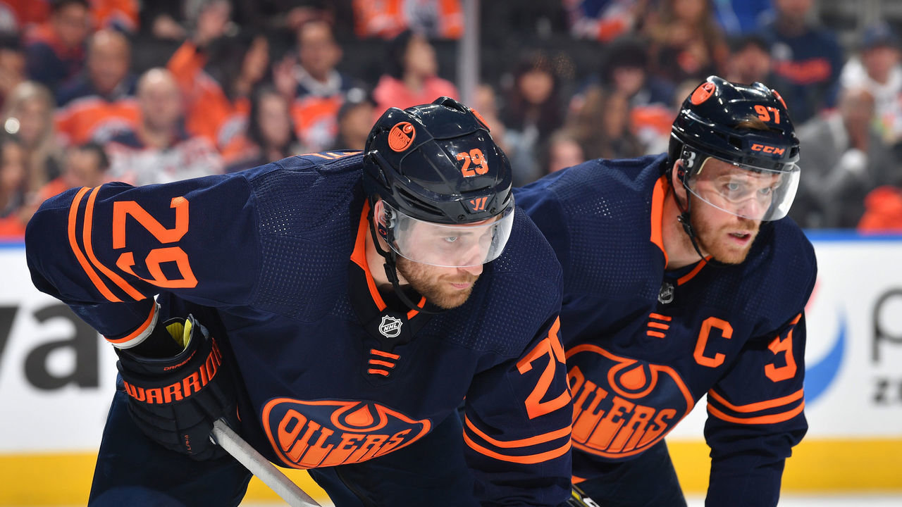 EDMONTON, AB - April 20: Leon Draisaitl #29 and Connor McDavid #97 of the Edmonton Oilers await a face-off during the game against the Dallas Stars on April 20, 2022 at Rogers Place in Edmonton, Alberta, Canada.