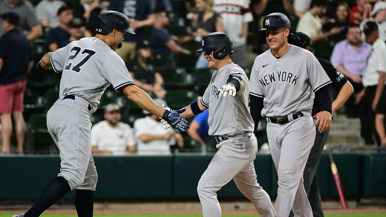CHICAGO, ILLINOIS - MAY 12: Josh Donaldson #28, Anthony Rizzo #48, and Giancarlo Stanton #27 of the New York Yankees after the home run in the eighth inning against the Chicago White Sox/ at Guaranteed Rate Field on May 12, 2022 in Chicago, Illinois.
