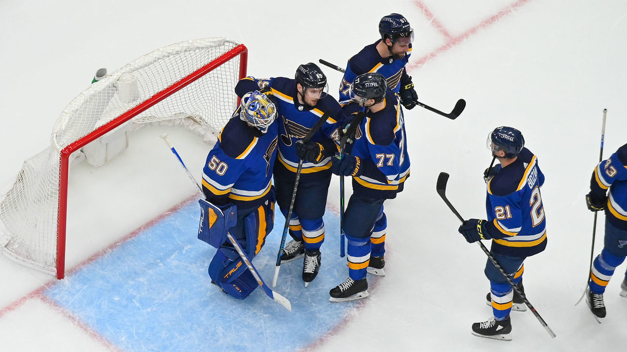 ST. LOUIS, MO - MAY 12: Members of the St. Louis Blues celebrate their teams victory over the Minnesota Wild in Game Six of the First Round of the 2022 Stanley Cup Playoffs at the Enterprise Center on May 12, 2022 in St. Louis, Missouri.