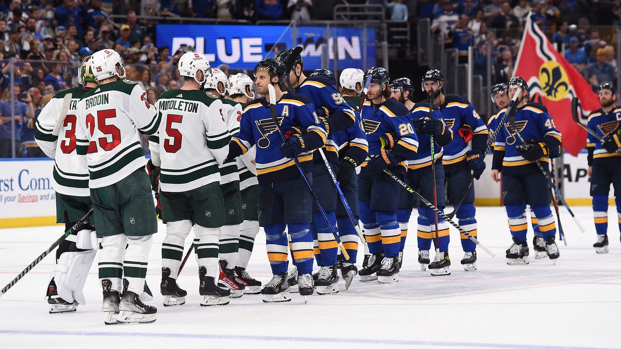ST. LOUIS, MO - MAY 12: Members St. Louis Blues shake hands with the Minnesota Wild after beating them in Game Six of the First Round of the 2022 Stanley Cup Playoffs at the Enterprise Center on May 12, 2022 in St. Louis, Missouri.