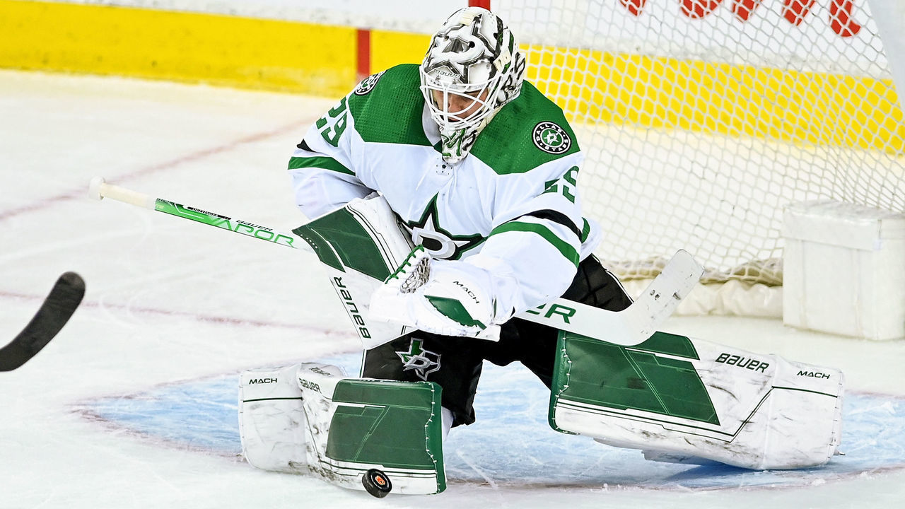 CALGARY, AB - MAY 11: Dallas Stars Goalie Jake Oettinger (29) covers the puck during the third period of game 5 of the first round of the NHL Stanley Cup Playoffs between the Calgary Flames and the Dallas Stars on May 11, 2022, at the Scotiabank Saddledome in Calgary, AB.