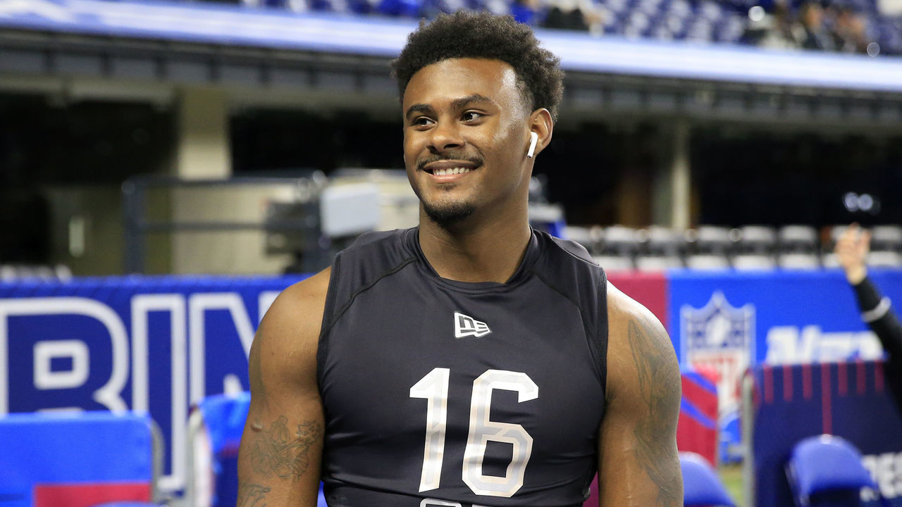 INDIANAPOLIS, INDIANA - MARCH 03: Malik Willis #QB16 of the Liberty Flames on the field during the NFL Combine at Lucas Oil Stadium on March 03, 2022 in Indianapolis, Indiana.