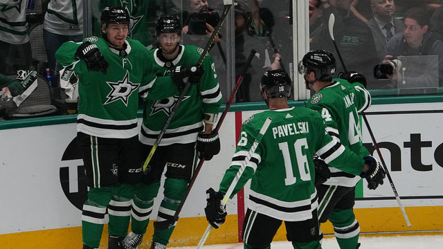 DALLAS, TX - MAY 13: Roope Hintz #24, John Klingberg #3, Joe Pavelski #16, Joel Hanley #44 and the Dallas Stars celebrate a goal against the Calgary Flames in Game Six of the First Round of the 2022 Stanley Cup Playoffs at the American Airlines Center on May 13, 2022 in Dallas, Texas.