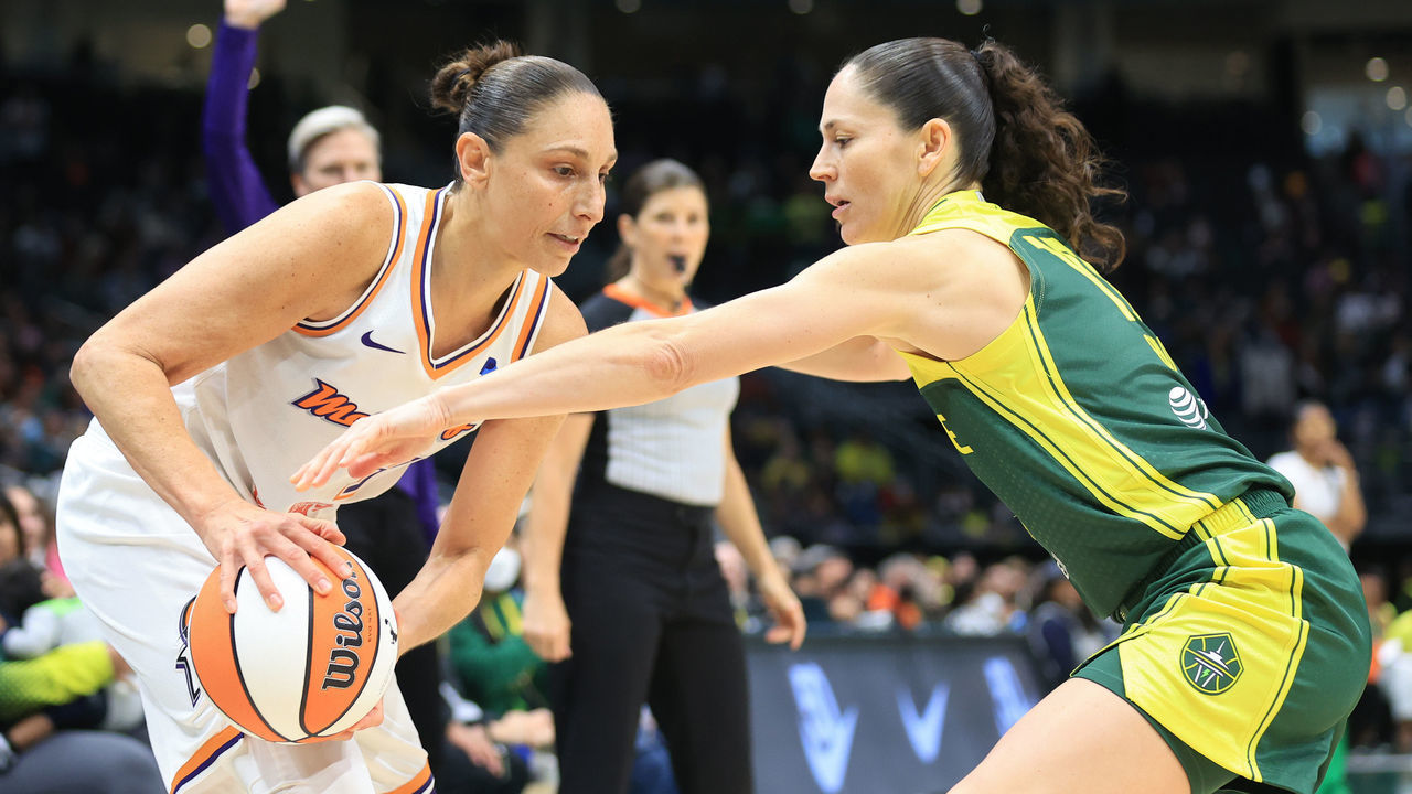 SEATTLE, WASHINGTON - MAY 14: Diana Taurasi #3 of the Phoenix Mercury handles the ball against Sue Bird #10 of the Seattle Storm during the second half at Climate Pledge Arena on May 14, 2022 in Seattle, Washington.