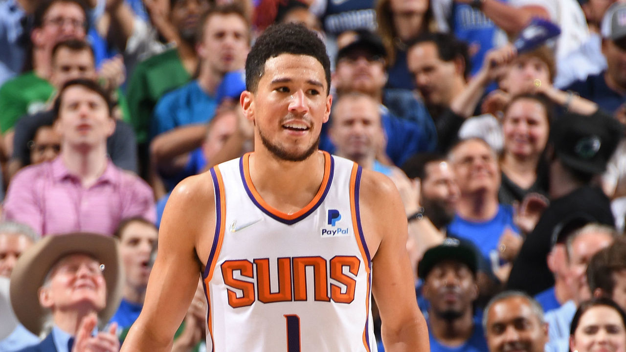 DALLAS, TX - MAY 12: Devin Booker #1 of the Phoenix Suns smiles and looks on during the game against the Dallas Mavericks during Game 6 of the 2022 NBA Playoffs Western Conference Semifinals on May 12, 2022 at the American Airlines Center in Dallas, Texas. Mandatory Copyright Notice: Copyright 2022 NBAE
