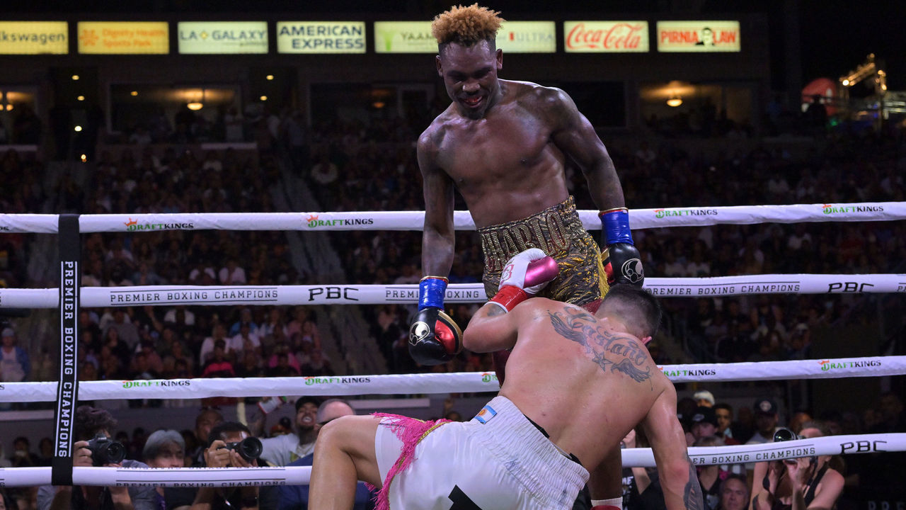 CARSON, CA - MAY 14: Jermell Charlo (gold/red shorts) knocks down Brian Castano (white/pink shorts) during their super middleweight title fight at Dignity Health Sports Park on May 14, 2022 in Carson, California. Charlo won by knockout in the 10th round.