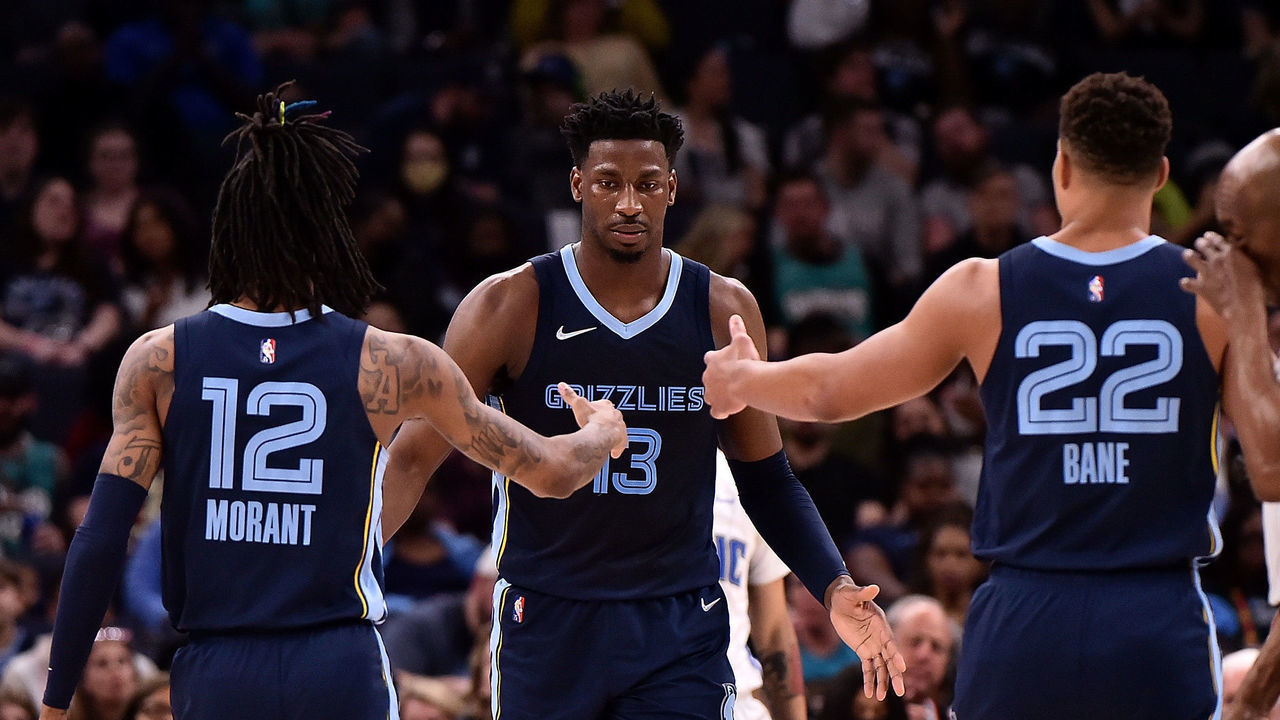 MEMPHIS, TENNESSEE - MARCH 05: Jaren Jackson Jr. #13 of the Memphis Grizzlies celebrates with Ja Morant #12 of the Memphis Grizzlies and Desmond Bane #22 of the Memphis Grizzlies against the Orlando Magic during the game at FedExForum on March 05, 2022 in Memphis, Tennessee.