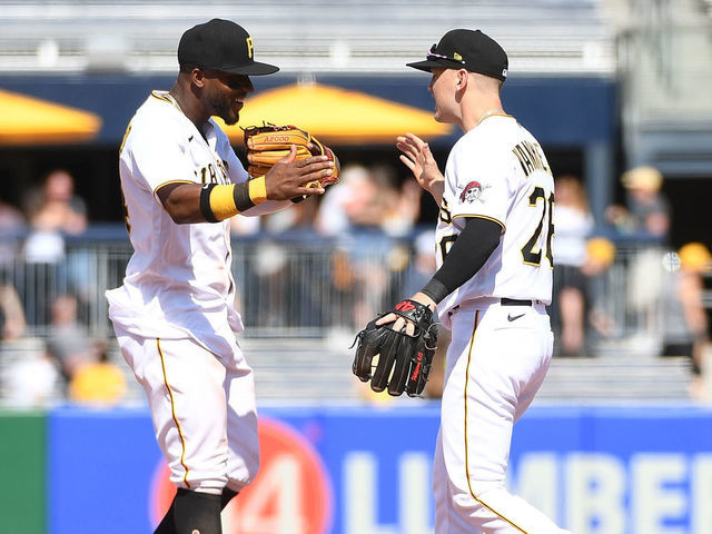 PITTSBURGH, PA - MAY 15: Rodolfo Castro #14 of the Pittsburgh Pirates celebrates with Josh VanMeter #26 after the final out in a 1-0 win over the Cincinnati Reds at PNC Park on May 15, 2022 in Pittsburgh, Pennsylvania. The Pirates won 1-0 despite being no hit by the Cincinnati Reds.