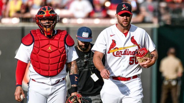 ST. LOUIS, MO - MAY 15: St. Louis Cardinals catcher Yadier Molina (4) and St. Louis Cardinals starting pitcher Adam Wainwright (50) walk from the bullpen getting ready to start their 311th game together during a game between the San Francisco Giants and the St. Louis Cardinals on May 15, 2022, at Busch Stadium in St. Louis MO