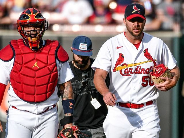 ST. LOUIS, MO - MAY 15: St. Louis Cardinals catcher Yadier Molina (4) and St. Louis Cardinals starting pitcher Adam Wainwright (50) walk from the bullpen getting ready to start their 311th game together during a game between the San Francisco Giants and the St. Louis Cardinals on May 15, 2022, at Busch Stadium in St. Louis MO