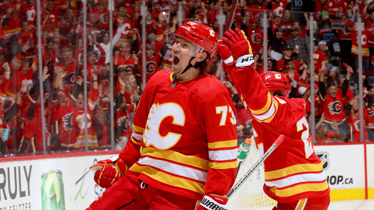 CALGARY, ALBERTA - MAY 15: Tyler Toffoli #73 and teammates of the Calgary Flames celebrate a goal against the Dallas Stars in Game Seven of the First Round of the 2022 Stanley Cup Playoffs at Scotiabank Saddledome on May 15, 2022 in Calgary, Alberta.