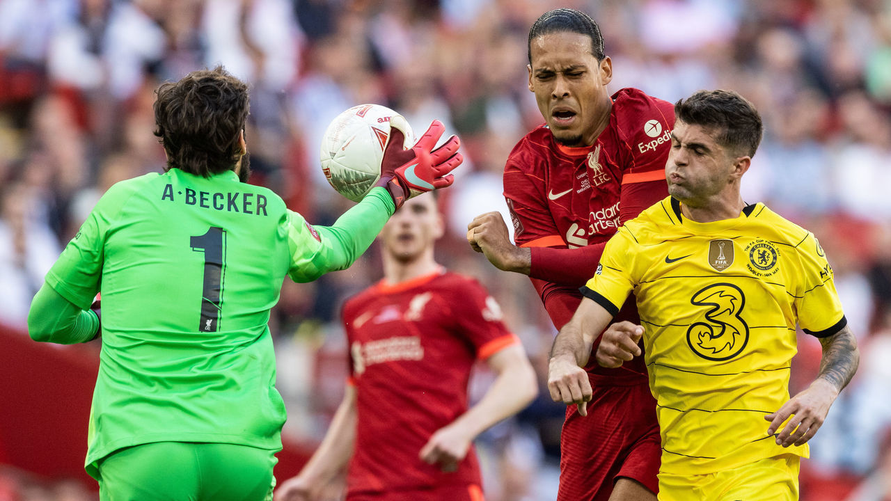 LONDON, ENGLAND - MAY 14: Liverpool's Alisson Becker beats Chelsea's Christian Pulisic to the ball as Liverpool's Virgil van Dijk looks on during The FA Cup Final match between Chelsea and Liverpool at Wembley Stadium on May 14, 2022 in London, England.