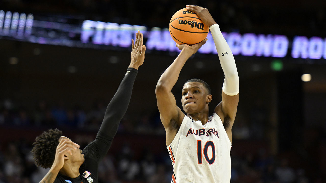 GREENVILLE, SOUTH CAROLINA - MARCH 20: Jabari Smith #10 of the Auburn Tigers shoots over Jordan Miller #11 of the Miami (Fl) Hurricanes in the first half during the second round of the 2022 NCAA Men's Basketball Tournament at Bon Secours Wellness Arena on March 20, 2022 in Greenville, South Carolina.