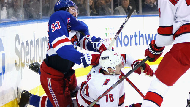 NEW YORK, NEW YORK - APRIL 26: Mika Zibanejad #93 of the New York Rangers and Brady Skjei #76 of the Carolina Hurricanes collide during the second period at Madison Square Garden on April 26, 2022 in New York City.