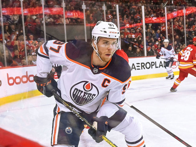 CALGARY, AB - MARCH 07: Edmonton Oilers Center Connor McDavid (97) skates with the puck during the first period of an NHL game where the Calgary Flames hosted the Edmonton Oilers on March 7, 2022, at the Scotiabank Saddledome in Calgary, AB.