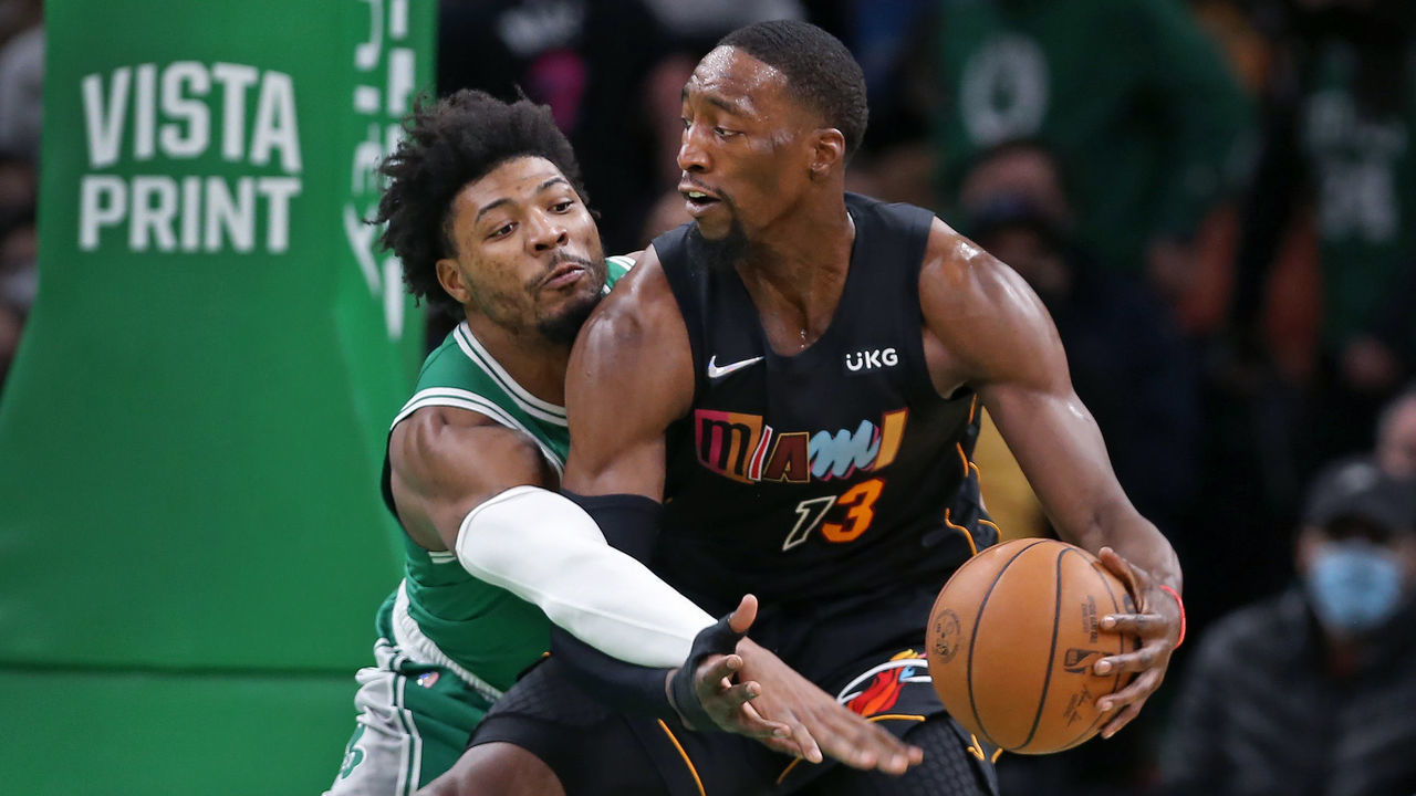 Boston - January 31: The Celtics Marcus Smart plays some tight defense vs. the Heat's Bam Adebayo in first half. The Boston Celtics hosted the Miami Heat in a regular season NBA basketball game at the TD Garden in Boston on Jan. 31, 2022.