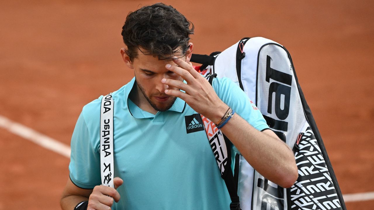 Austria's Dominic Thiem leaves the court after losing his match against Italy's Marco Cecchinato at the ATP 250 Geneva Open tennis tournament in Geneva on May 16, 2022.