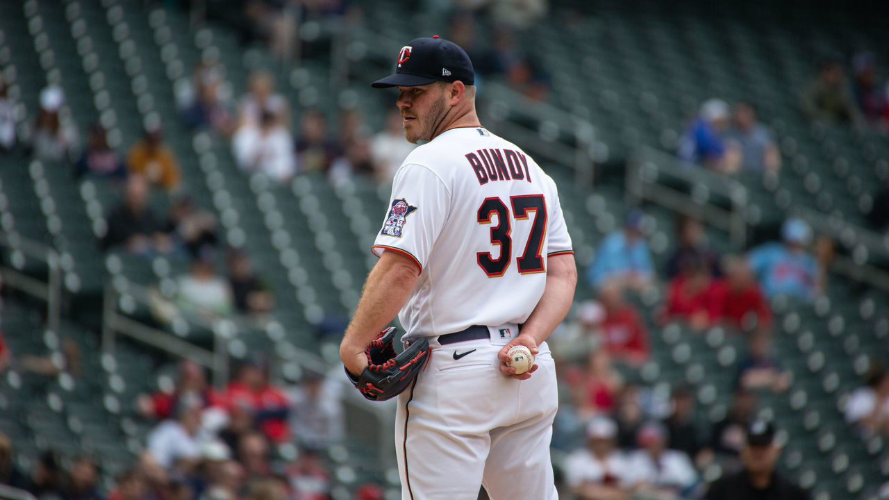 MINNEAPOLIS, MN - APRIL 23: Minnesota Twins starting pitcher Dylan Bundy (37) checks first base during the MLB game between the Chicago White Sox and the Minnesota Twins on April 23nd, 2022, at Target Field in Minneapolis, MN.(