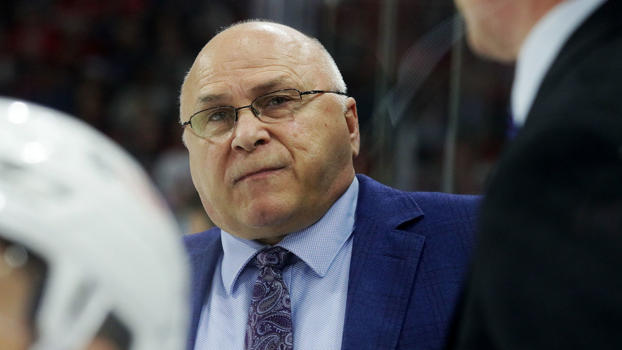 RALEIGH, NC - APRIL 8: Head coach Barry Trotz of the New York Islanders communicates with players and watches action on the ice from the bench area during an NHL game on April 8, 2022 at PNC Arena in Raleigh, North Carolina.