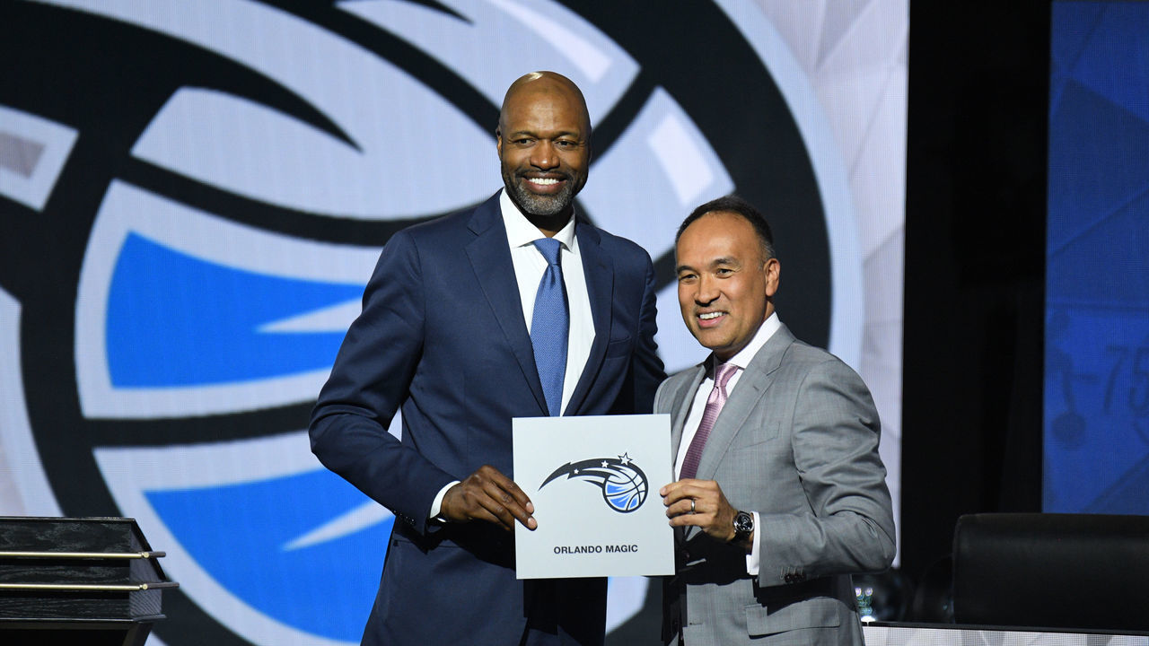 CHICAGO,IL - MAY 17: Deputy Commissioner of the NBA, Mark Tatum and Head Coach Jamahl Mosley of the Orland Magic hold up the card of the Orlando Magic after they get the 1st overall pick in the NBA Draftduring the 2022 NBA Draft Lottery at McCormick Place on May 17, 2022 in Chicago, Illinois. Mandatory Copyright Notice: Copyright 2022 NBAE